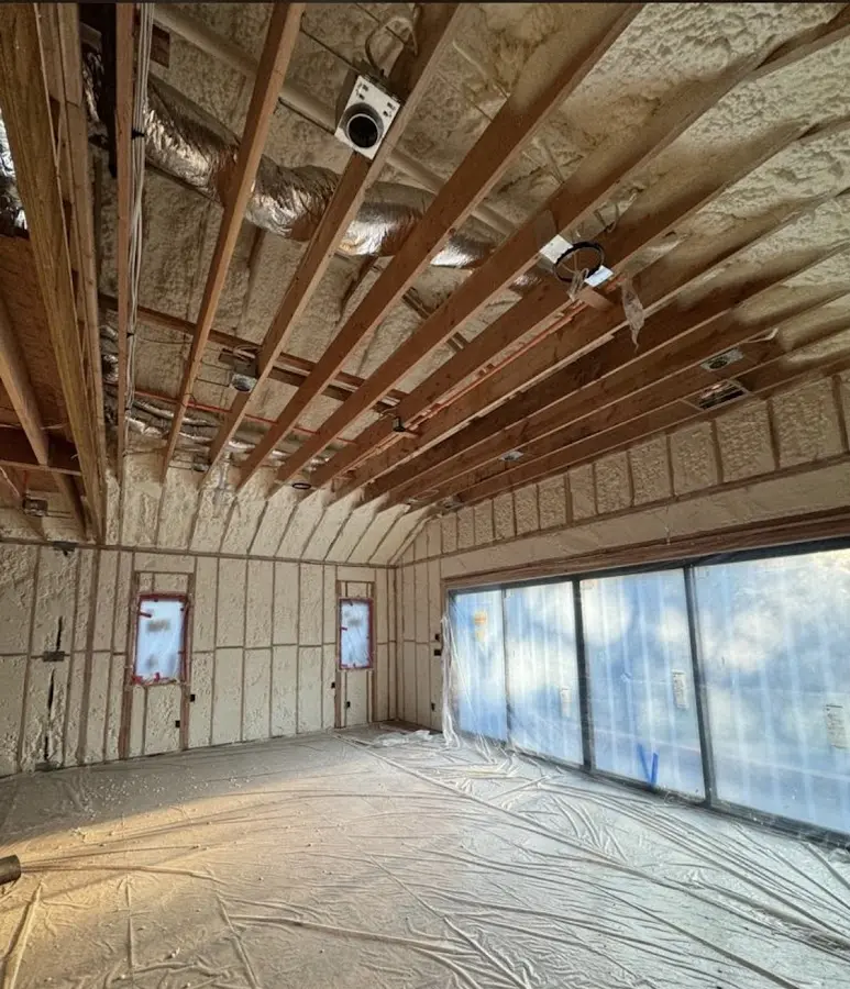 Interior walls and ceiling insulated with spray foam during new construction in Carolina Beach